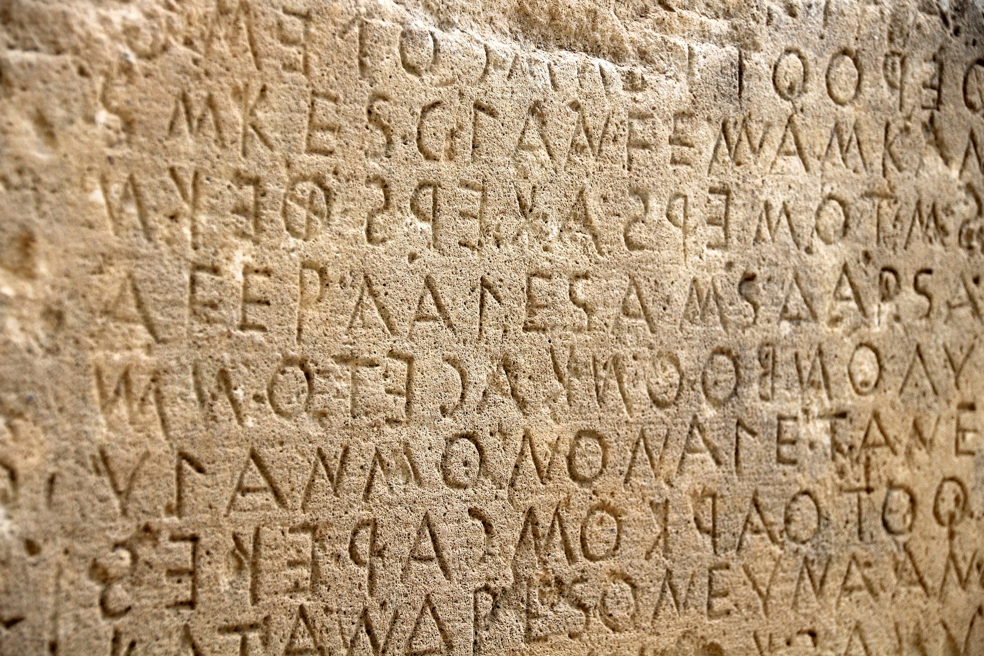 stone wall with carved letters